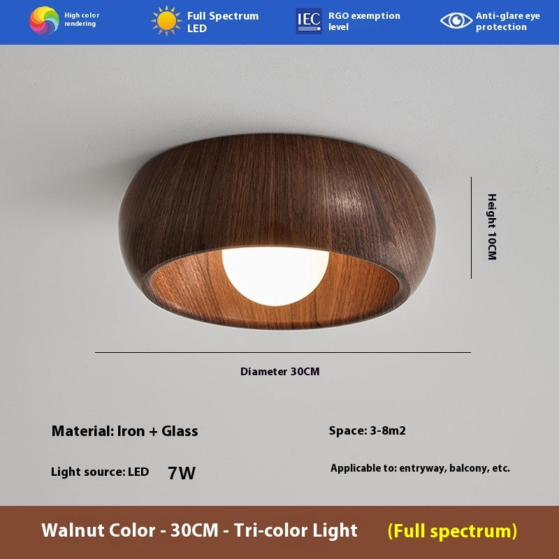 Houten plafondlamp van Eriks-shop met warm houten design en zacht licht, geschikt voor woonkamer of slaapkamer.