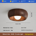 Houten plafondlamp van Eriks-shop met warm houten design en zacht licht, geschikt voor woonkamer of slaapkamer.